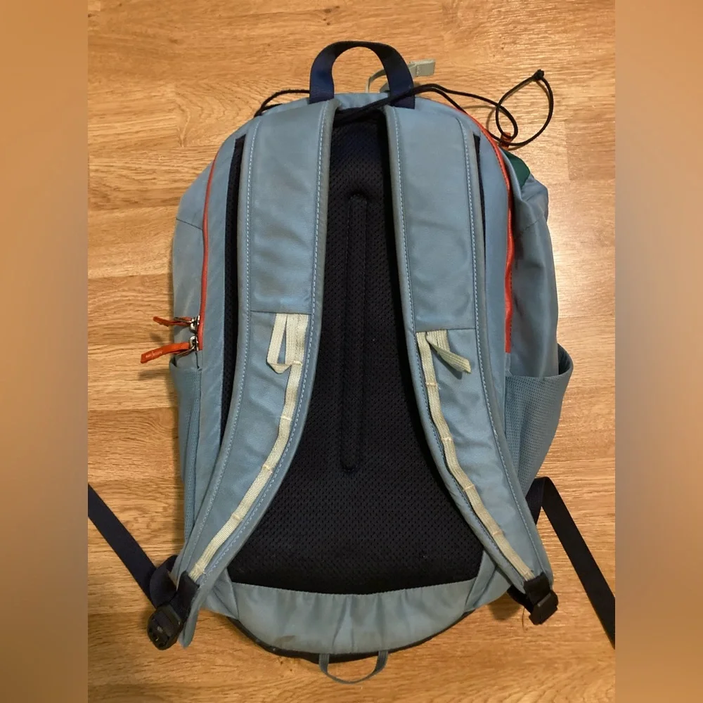 cotopaxi navy blue light blue green striped backpack